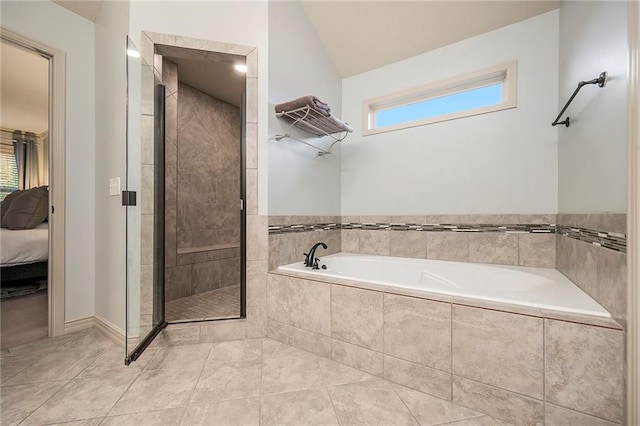 10601 N Euclid Ave, Kansas City, MO 64155 - full bathroom with ensuite bathroom, a bath, a shower stall, plenty of natural light, and lofted ceiling