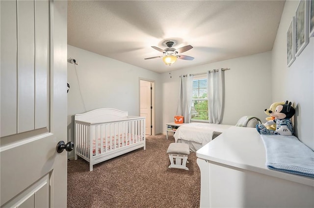 10601 N Euclid Ave, Kansas City, MO 64155 - bedroom with dark colored carpet and ceiling fan