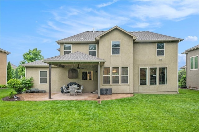 10601 N Euclid Ave, Kansas City, MO 64155 - rear view of house featuring ceiling fan, a patio, a lawn, stucco siding, and outdoor lounge area