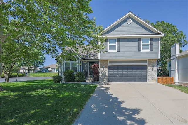 7500 N Oakland Ave, Kansas City, MO 64158 - view of front facade with a garage and concrete driveway