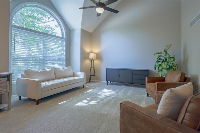 7500 N Oakland Ave, Kansas City, MO 64158 - living room featuring ceiling fan, light colored carpet, lofted ceiling, and baseboards
