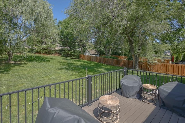 7500 N Oakland Ave, Kansas City, MO 64158 - wooden terrace featuring a grill and view of scattered trees