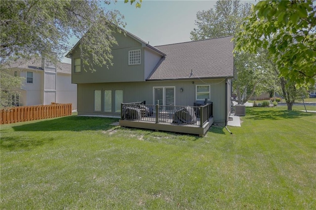 7500 N Oakland Ave, Kansas City, MO 64158 - rear view of house with a wooden deck, cooling unit, and a shingled roof