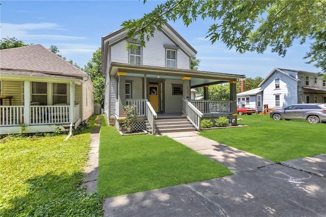 228 S Elm St, Ottawa, KS 66067 - view of front of house featuring covered porch and a front yard