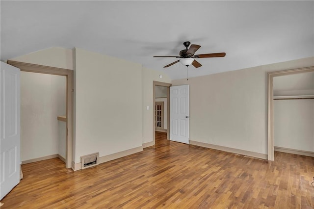 228 S Elm St, Ottawa, KS 66067 - unfurnished bedroom with light wood-type flooring, baseboards, a ceiling fan, and a closet