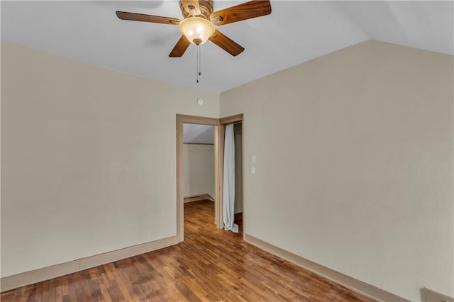 228 S Elm St, Ottawa, KS 66067 - empty room featuring ceiling fan, wood finished floors, and lofted ceiling