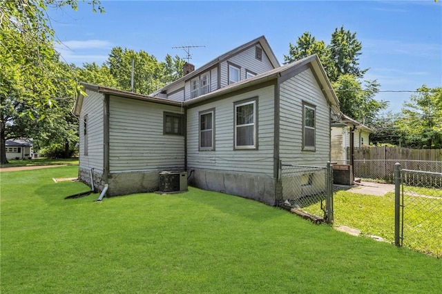 228 S Elm St, Ottawa, KS 66067 - view of property exterior with central AC and a chimney