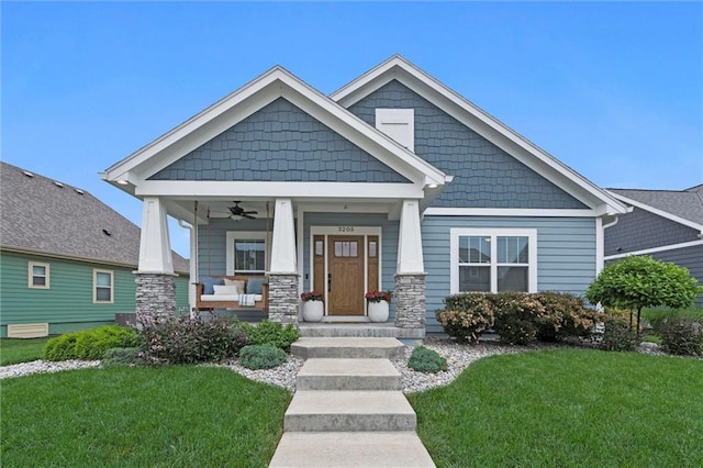 3205 SW Mary St, Lees Summit, MO 64081 - craftsman-style house featuring a porch, ceiling fan, and a front yard
