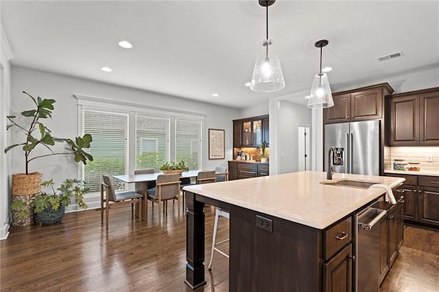 3205 SW Mary St, Lees Summit, MO 64081 - kitchen featuring high quality fridge, an island with sink, dark brown cabinets, recessed lighting, and dark wood-style floors