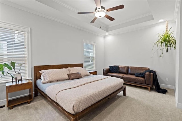 3205 SW Mary St, Lees Summit, MO 64081 - bedroom featuring light carpet, ornamental molding, baseboards, a tray ceiling, and a ceiling fan