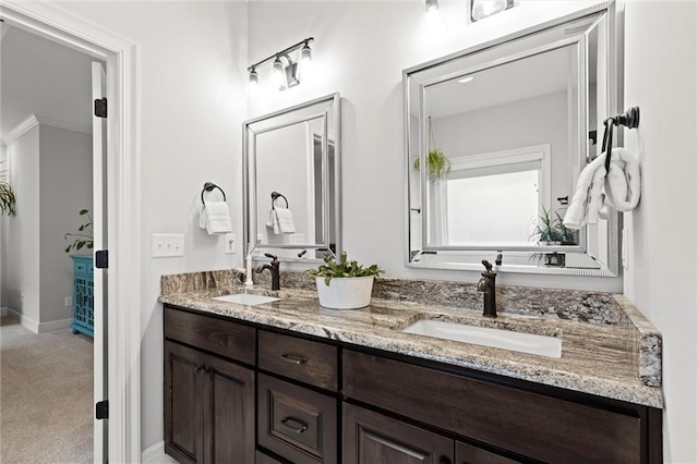 3205 SW Mary St, Lees Summit, MO 64081 - bathroom with double vanity and baseboards