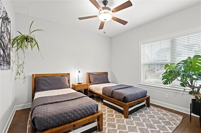 3205 SW Mary St, Lees Summit, MO 64081 - bedroom featuring baseboards, wood finished floors, and ceiling fan