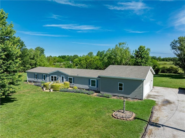 514 E 614th St, Girard, KS 66743 - single story home featuring a front yard, driveway, roof with shingles, and a garage
