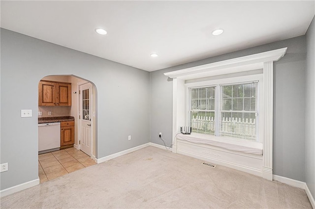 614 S 7th St, Atchison, KS 66002 - unfurnished room featuring light colored carpet, arched walkways, baseboards, and recessed lighting