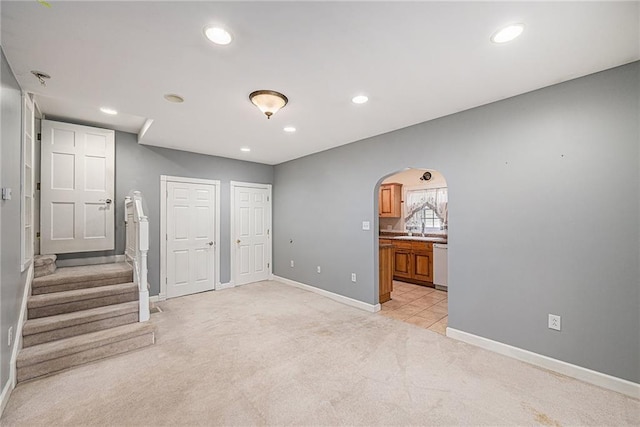 614 S 7th St, Atchison, KS 66002 - interior space with light carpet, baseboards, arched walkways, recessed lighting, and stairway