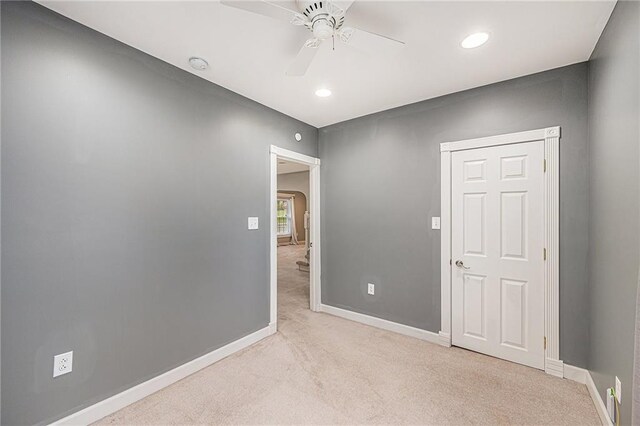 614 S 7th St, Atchison, KS 66002 - unfurnished room featuring carpet floors, arched walkways, a ceiling fan, baseboards, and a smoke detector