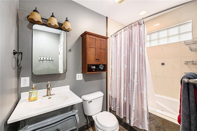 614 S 7th St, Atchison, KS 66002 - bathroom featuring shower / tub combo, vanity, and toilet