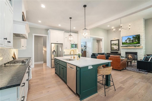 4112 W 156th St, Overland Park, KS 66224 - kitchen with a sink, green cabinetry, stainless steel appliances, white cabinetry, and tasteful backsplash