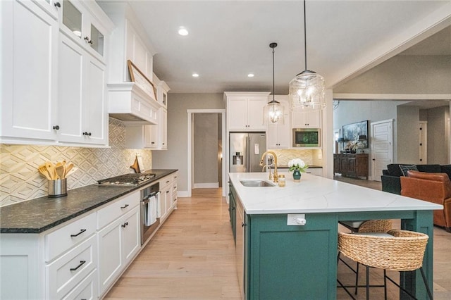 4112 W 156th St, Overland Park, KS 66224 - kitchen featuring appliances with stainless steel finishes, a sink, white cabinetry, and recessed lighting
