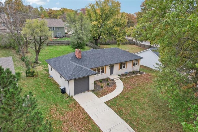 618 E 108th Ter, Kansas City, MO 64131 - ranch-style house with a chimney, a shingled roof, and concrete driveway