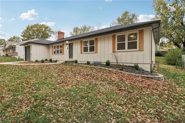 618 E 108th Ter, Kansas City, MO 64131 - single story home with a chimney, board and batten siding, and a front lawn
