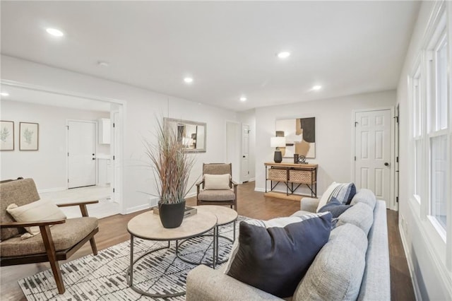 618 E 108th Ter, Kansas City, MO 64131 - living area featuring recessed lighting, wood finished floors, and baseboards