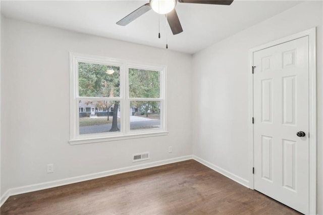 618 E 108th Ter, Kansas City, MO 64131 - unfurnished room featuring ceiling fan, dark wood-style floors, and baseboards