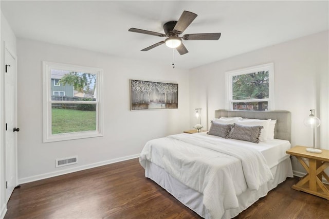 618 E 108th Ter, Kansas City, MO 64131 - bedroom with wood finished floors, baseboards, and a ceiling fan