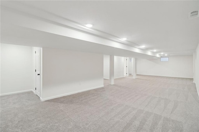 618 E 108th Ter, Kansas City, MO 64131 - finished below grade area featuring light colored carpet, recessed lighting, and baseboards