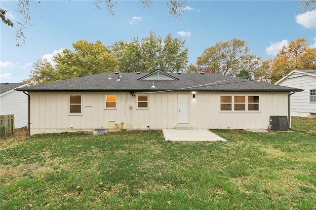 618 E 108th Ter, Kansas City, MO 64131 - rear view of property with board and batten siding, a yard, a patio area, and central AC