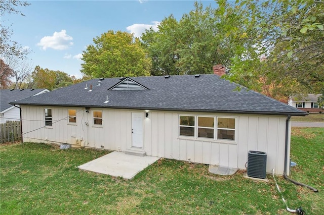618 E 108th Ter, Kansas City, MO 64131 - back of property with a shingled roof, cooling unit, board and batten siding, a chimney, and a patio area