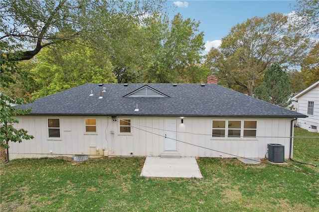 618 E 108th Ter, Kansas City, MO 64131 - rear view of house featuring roof with shingles, board and batten siding, central air condition unit, and a chimney