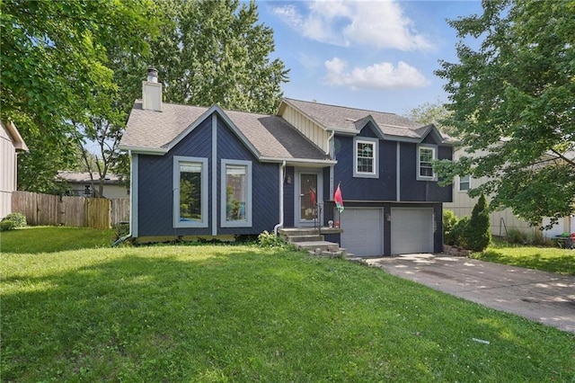 14713 W 149th Ct, Olathe, KS 66062 - split level home with an attached garage, a chimney, driveway, and a shingled roof