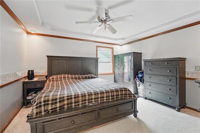 14713 W 149th Ct, Olathe, KS 66062 - bedroom with ornamental molding, light colored carpet, a tray ceiling, and ceiling fan