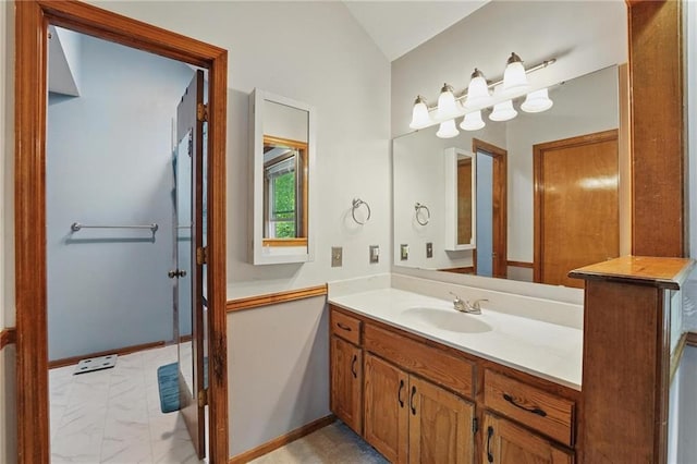 14713 W 149th Ct, Olathe, KS 66062 - bathroom featuring vanity, marble look tile flooring, and lofted ceiling