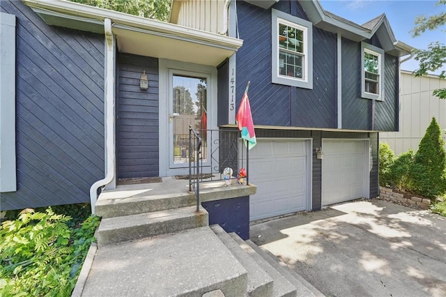 14713 W 149th Ct, Olathe, KS 66062 - doorway to property featuring asphalt driveway and a garage