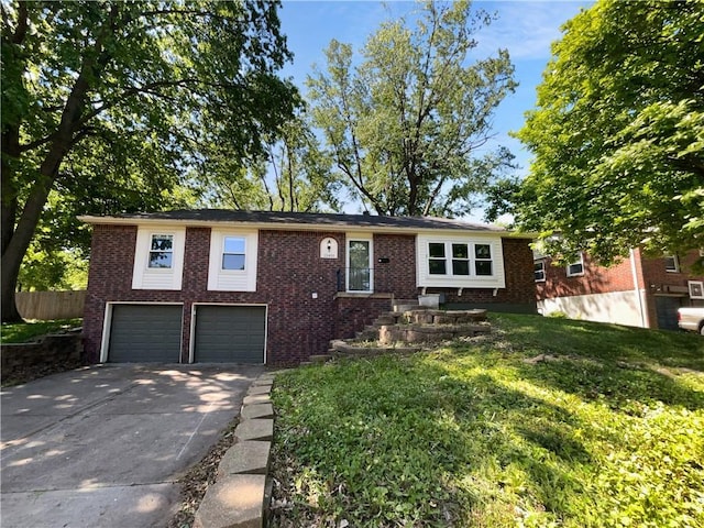 15405 E 40th St, Independence, MO 64055 - view of front of home featuring brick siding, concrete driveway, and an attached garage