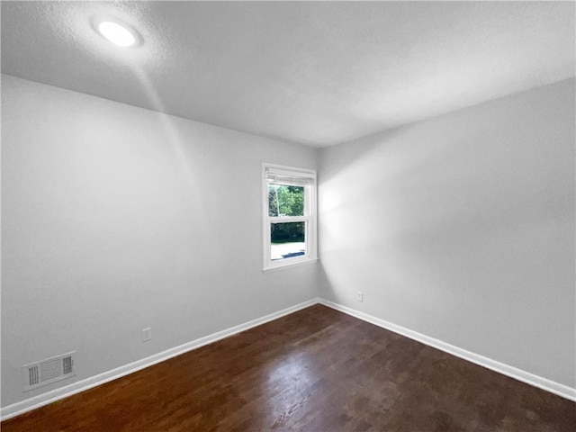 15405 E 40th St, Independence, MO 64055 - unfurnished room featuring dark wood-style flooring and baseboards