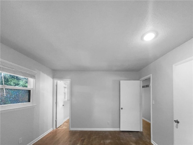 15405 E 40th St, Independence, MO 64055 - unfurnished bedroom with wood finished floors and baseboards