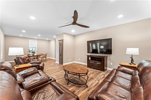 1105 S Gordon St, Concordia, MO 64020 - living room with ceiling fan, light wood finished floors, baseboards, and recessed lighting
