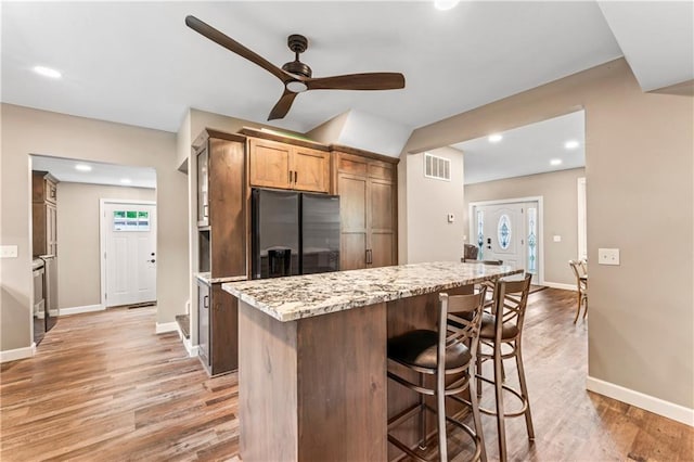 1105 S Gordon St, Concordia, MO 64020 - kitchen featuring stainless steel fridge with ice dispenser, a ceiling fan, light wood-style flooring, baseboards, and recessed lighting