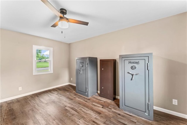 1105 S Gordon St, Concordia, MO 64020 - unfurnished bedroom with wood finished floors, baseboards, and ceiling fan