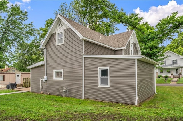 1105 S Gordon St, Concordia, MO 64020 - view of side of property featuring a lawn and roof with shingles