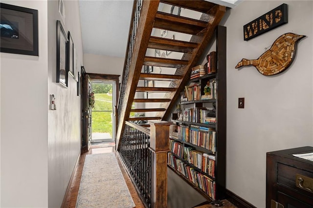 218 NE Bayview Dr, Lees Summit, MO 64064 - hallway featuring wood finished floors, baseboards, and stairs
