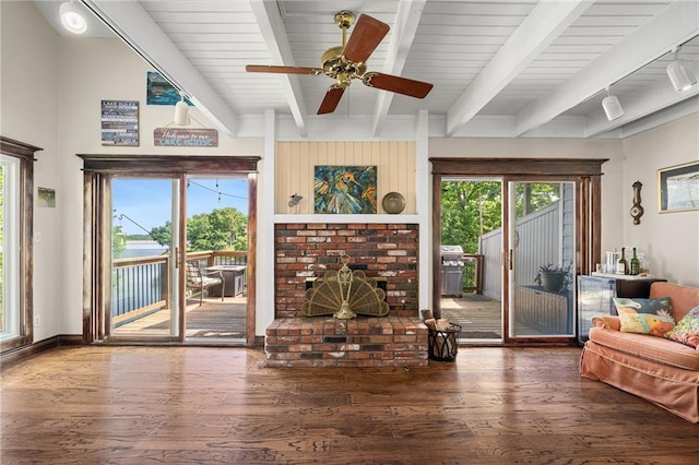 218 NE Bayview Dr, Lees Summit, MO 64064 - living area with wood finished floors, beam ceiling, and a ceiling fan
