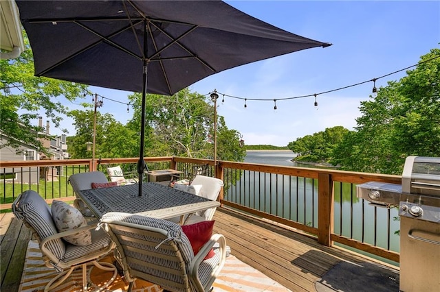 218 NE Bayview Dr, Lees Summit, MO 64064 - wooden terrace with a water view and outdoor dining space