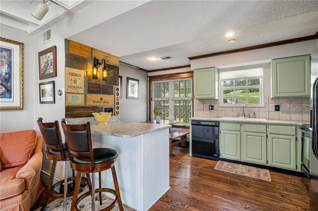218 NE Bayview Dr, Lees Summit, MO 64064 - kitchen featuring dishwasher, green cabinetry, a sink, light countertops, and crown molding
