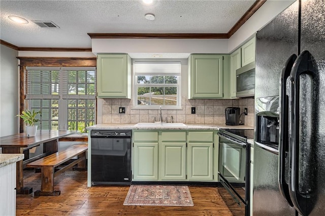 218 NE Bayview Dr, Lees Summit, MO 64064 - kitchen with black appliances, green cabinets, a sink, crown molding, and a textured ceiling