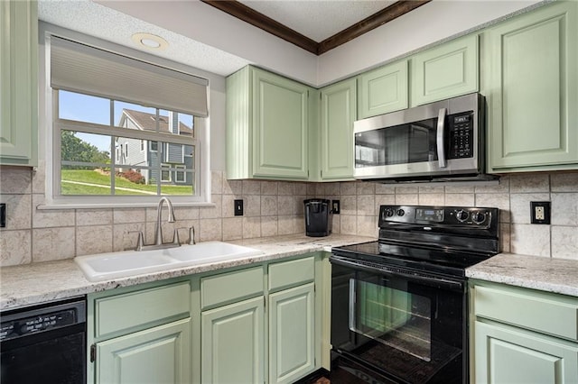 218 NE Bayview Dr, Lees Summit, MO 64064 - kitchen with black appliances, green cabinets, a sink, light countertops, and crown molding