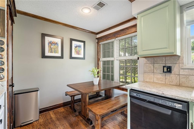 218 NE Bayview Dr, Lees Summit, MO 64064 - dining space featuring ornamental molding, dark wood finished floors, a textured ceiling, and baseboards